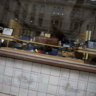Reflection of Historic London Architecture in Shoemaker's Window