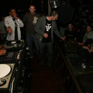 DJ spins tunes for crowded pub