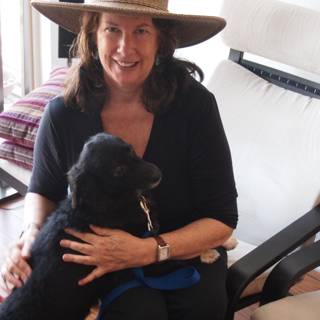 Woman with Hat and Black Dog