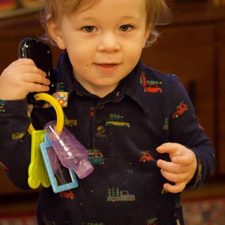 Toddler Playing with Toy Keys and Phone at Christmas