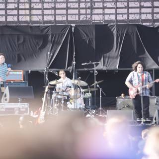 Grooving on Stage: The Band Performs for Coachella Sunday Crowd