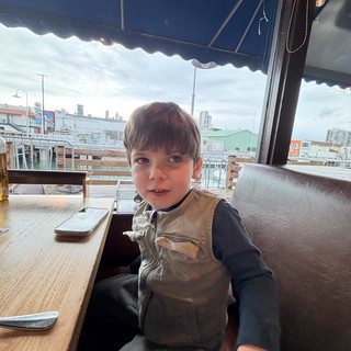 Young Boy at Urban Rooftop Café