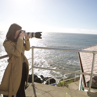 Photographer Capturing the Pacific Coast Horizon