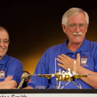 Charles Elachi and Companion with Model Airplane at Phoenix Landing Press Conference