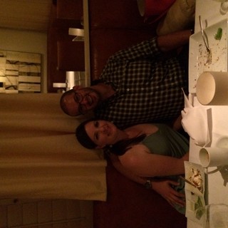 Couple Smiling Together at Romantic Restaurant Dinner