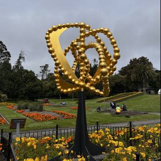 Golden Park Statue with Blooming Beauty