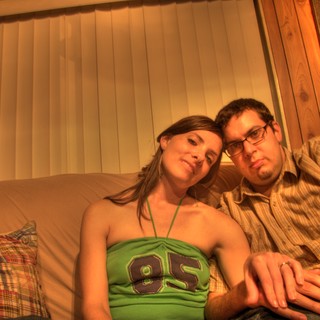 Couple Relaxing Together on Couch at Home