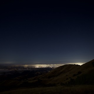 City Lights Glowing Beneath a Starlit Night Sky