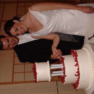 Bride and Groom Cut Their Wedding Cake Together