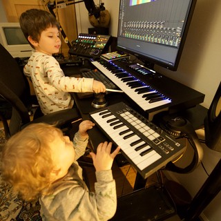 Young Brothers Creating Music in Home Recording Studio