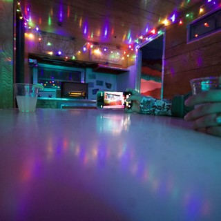 Intimate Evening at Colorful String-Lit Bar Counter