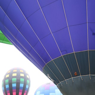 Rainbow of Giants: Hot Air Balloons at Ground Level