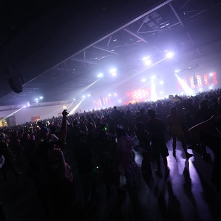Massive Indoor Rave Crowd Surges Toward Blazing Stage