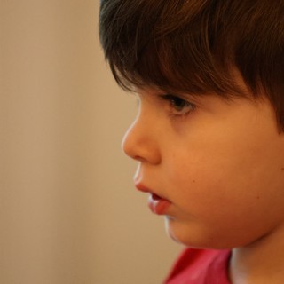 Young Boy in Contemplative Profile Portrait