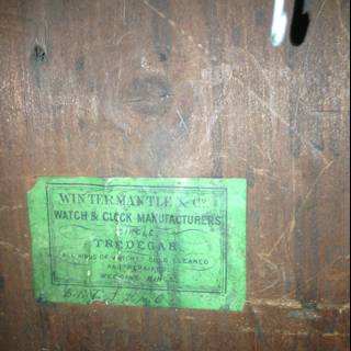 Text on a Green and White Wooden Label