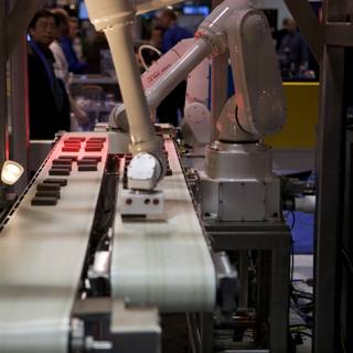 Automating the Factory: A Robot at Work on the Conveyor Belt