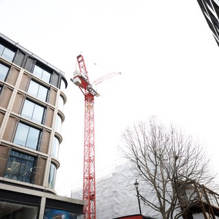 Red Construction Crane Between Modern London Buildings
