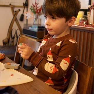 Young Boy Enjoying Christmas Evening at Home