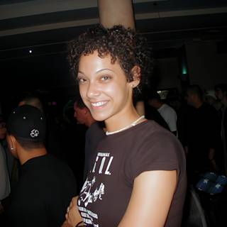 Curly-Haired Beauty in the Nightclub Crowd