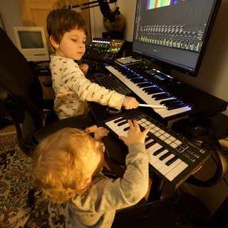 Young Brothers Creating Music in Home Recording Studio