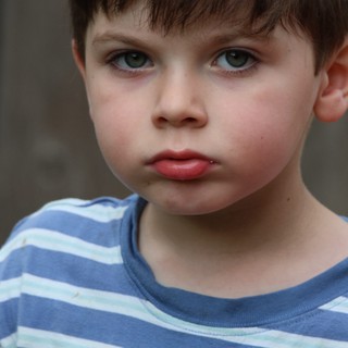Young Boy in Blue Striped Shirt - Close Portrait