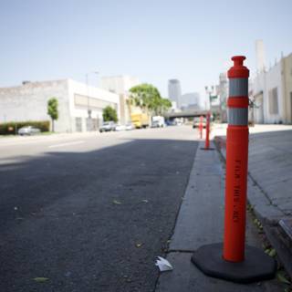 Red and White Traffic Cone on the City Street