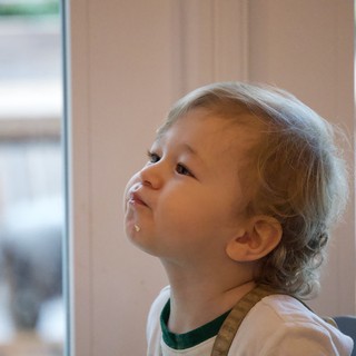 Young Child Looking Up with Wonder and Curiosity