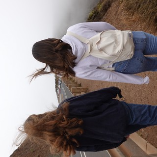 Two Women Walking in Strong Coastal Wind