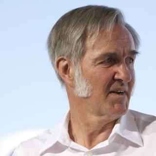 Grey-haired Man in White Shirt
