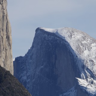 Half Dome's Iconic Silhouette Framed by El Capitan