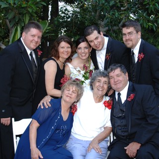 Family Wedding Portrait in Lush Garden Setting