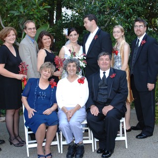 Family Wedding Portrait in Lush Garden Setting