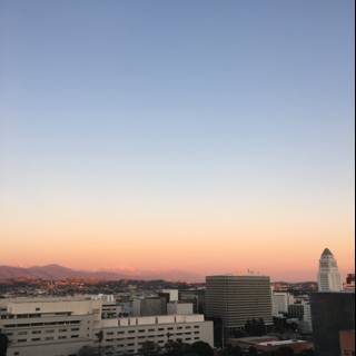 City Sunset with Mountain Backdrop