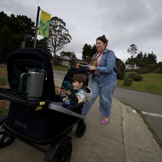 Mother and Child Strolling Through Suburban Park