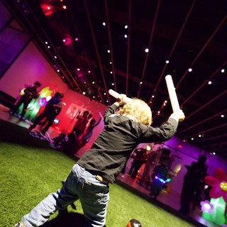 Child Playing Baseball at Baby Rave Event
