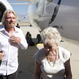 Richard Branson and companions beside their aircraft