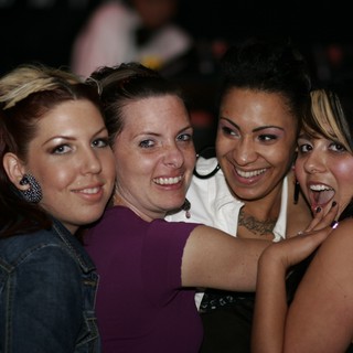 Four Friends Celebrate at a Nightclub Event 2006