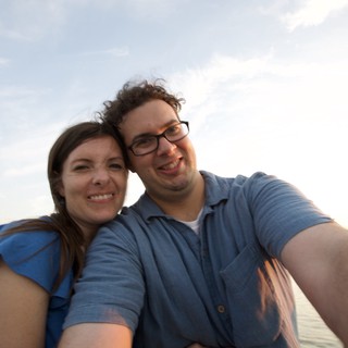 Couple's Joyful Selfie at Beachside Sunset