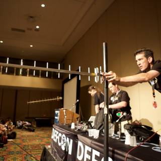 Man Holding a Pole at Defcon 18 Concert