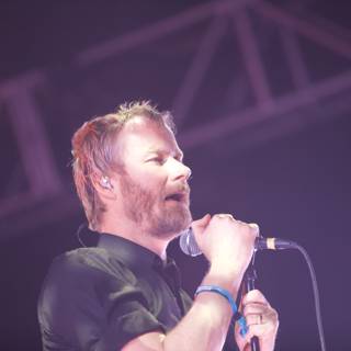 Rocking the Mic Caption: Matt Berninger electrifies the crowd with his solo performance at Coachella 2011.