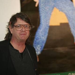 Man with Glasses Admiring Artwork