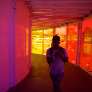 A Colorful Transition: Man Navigating Through Vivid Corridors
