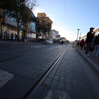 Twilight on a European Shopping Street with Tram Tracks