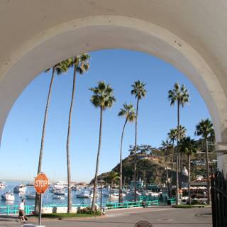A Serene Harbor View from an Archway