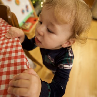 Young Child Drawing at Table on Christmas Morning