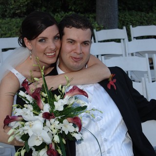 Newlyweds Embrace After Outdoor Wedding Ceremony