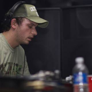Andy C Spinning Tracks in a Green Tee