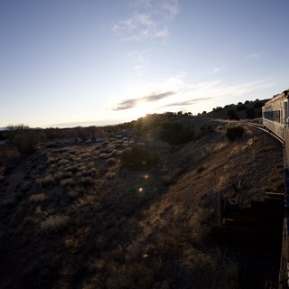Sunset Train Journey Through Arizona Desert Landscape