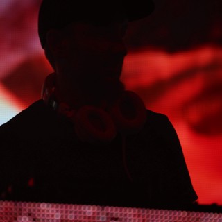 DJ Silhouette Bathed in Red Stage Light