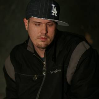 Man in a Jacket and Baseball Cap